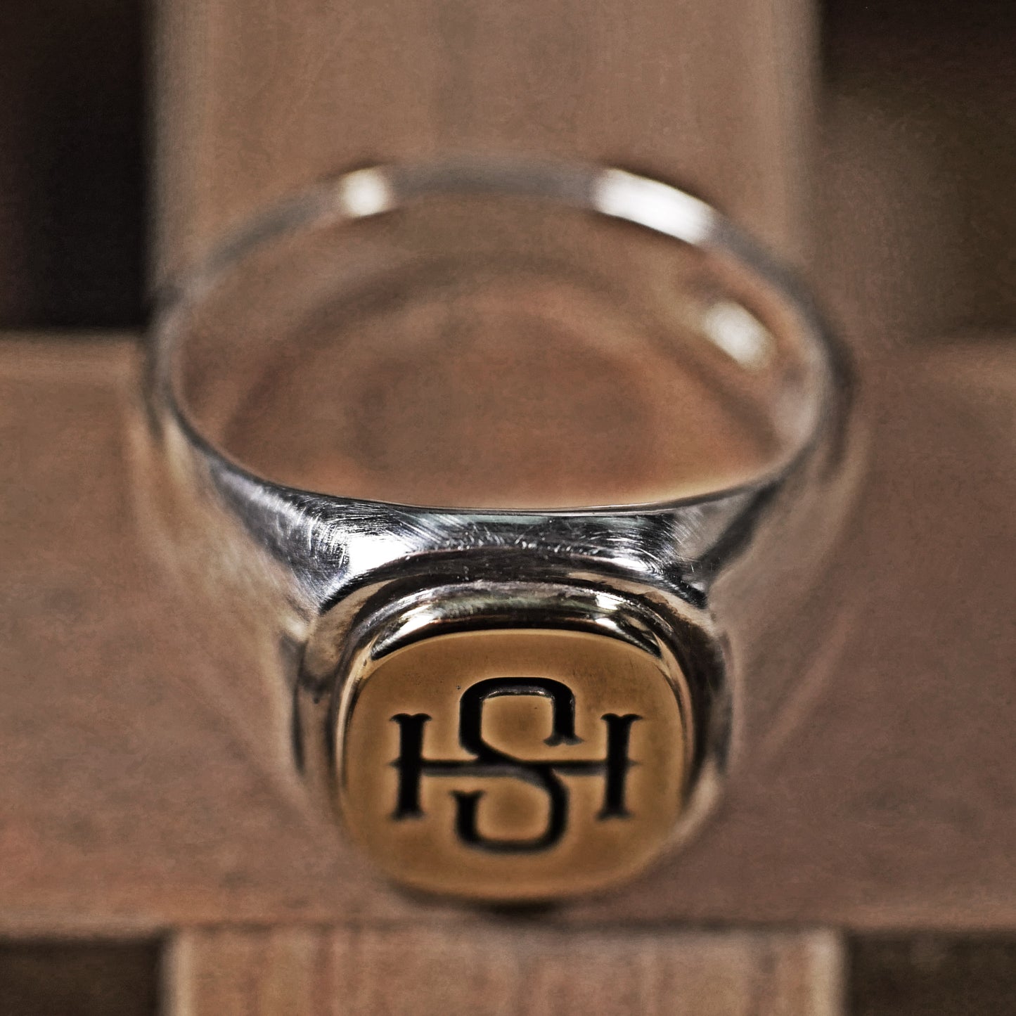 Semi polished brass face simple monogram silver ring