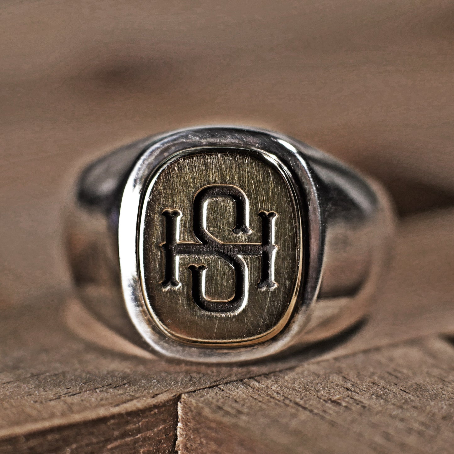 Semi polished brass face simple monogram silver ring