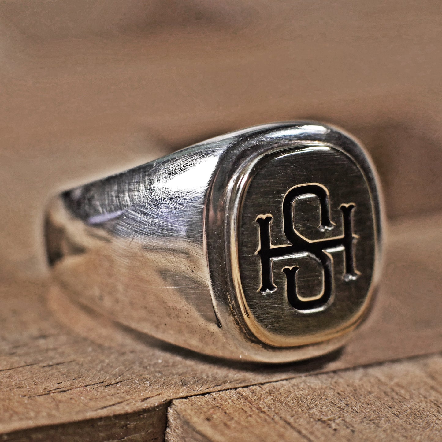 Semi polished brass face simple monogram silver ring